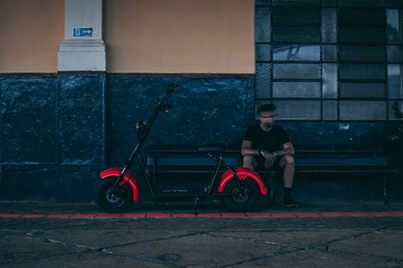 man and electric scooter